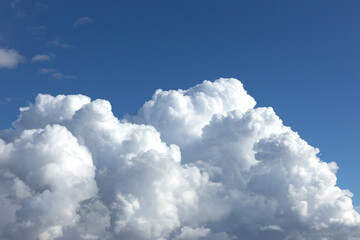 Naklejka na ściany i meble White fluffy clouds in a blue sky. High quality photo