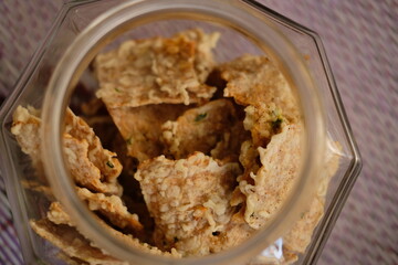 Dry tempeh chips. Tempeh chips in a jar