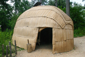 Jamestown Historic Park in Virginia looking at Traditional Native American Dwelling Replicas - obrazy, fototapety, plakaty
