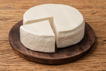 Artisanal fresh Canastra cheese from Minas Gerais, Brazil over wooden board