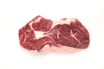 Raw Steak Isolated on White. Sliced grilled meat steak New York or Ribeye with spices rosemary and...