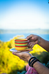 cup of hot chocolate with a lake view El Salvador - obrazy, fototapety, plakaty
