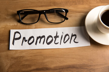 Promotion lettering on paper, glasses and coffee