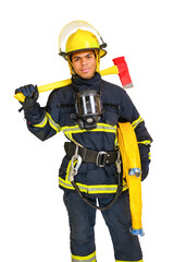 Young smiling African-American fireman in uniform and red Santa Hat holds fire hose and axe in...