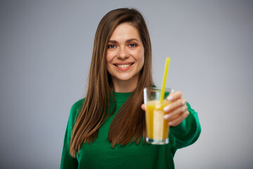 Young woman holding glass with orange juice. Isolated advertising portrait.