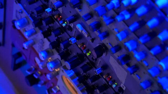 Studio sound. Analog mixing console. Cable switching. Sound engineer. Sequencer. Acoustic system. Massivars Recording Studio in Italy Milano 12.2022