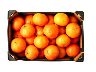 Box of fresh clementine in dark box on white isolated background. Fresh fruit. Food supply. Premium product for sale.