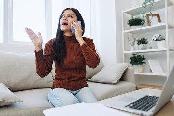 Woman talking on phone angry and sad at home, fight over phone, bad news