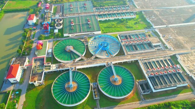 Drones are flying over water treatment plants, wastewater treatment ponds to remove chemicals and contaminants. tap water industry for consumption. pure drinking water concept. 4K
