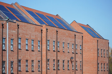New modern apartment buildings with solar panels on the roof in London UK