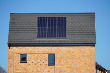 Modern house with solar panels on the roof in London UK