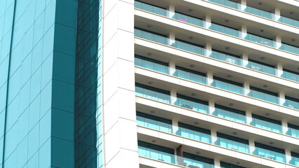 Details of high rise building. Residential house exterior. Low angle view. Selective focus included. Noise and grain included.