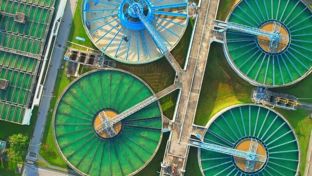 Drones are flying over water treatment plants, wastewater treatment ponds to remove chemicals and contaminants. tap water industry for consumption. pure drinking water concept. 4K
