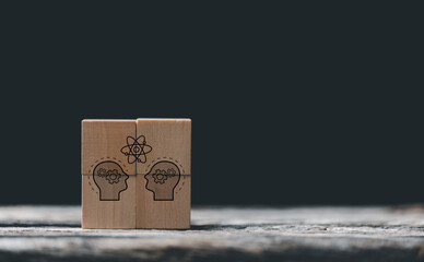 Knowledge and education concept. Concept creative idea and innovation. Hand choose wooden cube block with head human symbol and light bulb icon. Learning with smart technology.
