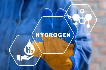 Engineer using virtual touchscreen presses word: HYDROGEN. Concept of hydrogen production. H2 Fuel...
