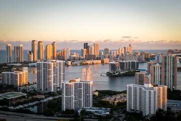 Sunny Isles city skyline at sunset with a warm glow
