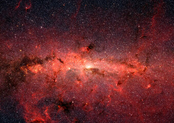 The center of the Milky Way's galaxy. Red clouds of obscuring dust and gas in outer space. Digitally enhanced. Elements of this image furnished by NASA.  