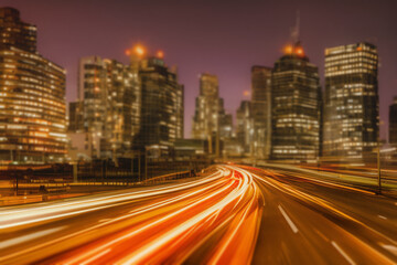 Fototapeta na wymiar motion blur long exposure traffic at night in cityscape created using Generative AI