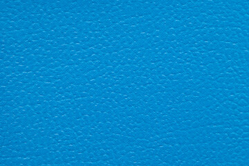 Closeup detail of blue leather texture background.