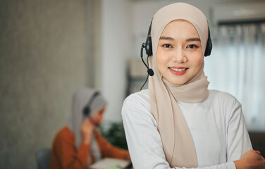 Muslim woman wearing headsets.