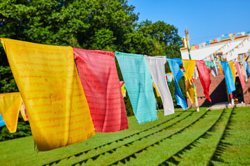 Tibetan Mongolian Buddhist Cultural Center with colorful prayer flags on ropes