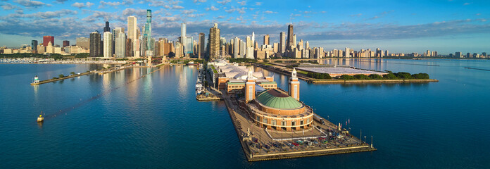 Stunning panorama of entire Navy Pier on Lake Michigan in Chicago with skyline during morning light