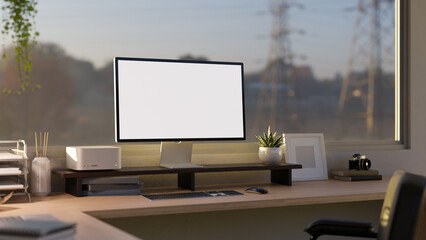 Modern office desk against the windows, PC desktop computer mockup and office supplies on table