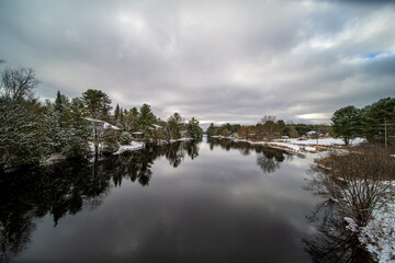 Reflection houses on lake winter day  cold and beautiful 