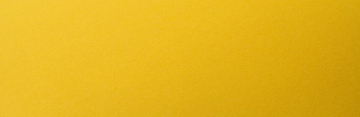 質感のある黄色いクラフトペーパーの背景テクスチャー