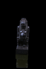 statue made of basalt stone, glass and metal dating back to the Pharaonic era
