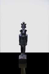 statue made of basalt stone, glass and metal dating back to the Pharaonic era