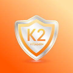 Vitamin K2 shield orange. Protect the body stay healthy. For nutrition products food. Metal aluminum label 3d isolated realistic on solid background. Medical scientific concepts. Vector illustration.