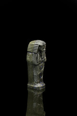 Fototapeta na wymiar statue made of basalt stone, glass and metal dating back to the Pharaonic era