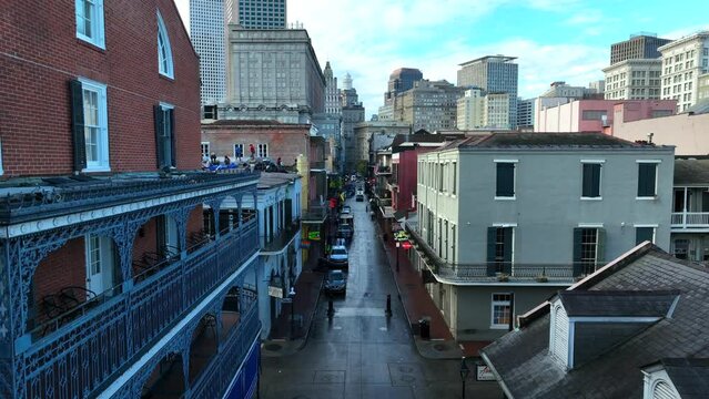 Bourbon Street rising aerial reveal in downtown French Quarter of New Orleans Louisiana.