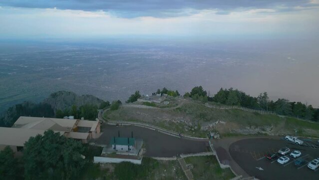 Structures And Carpark Overlooking Sandia Crest Mountains Near Albuquerque, New Mexico. Aerial Drone Shot