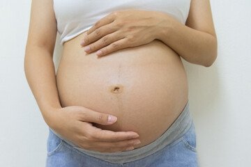 Close up belly pregnant woman wear tank top