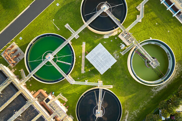 Aerial view of modern water cleaning facility at urban wastewater treatment plant. Purification...