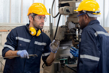 Engineer man training with foreman for apprentice using lathe, apprenticeship teaching with worker,...