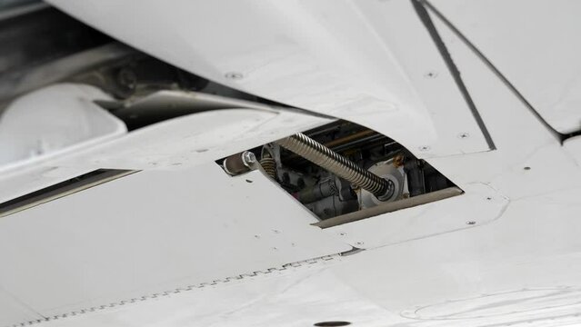 Rotating Worm Screw in Airplane Wing to Retract Flap Panel. Close Up.