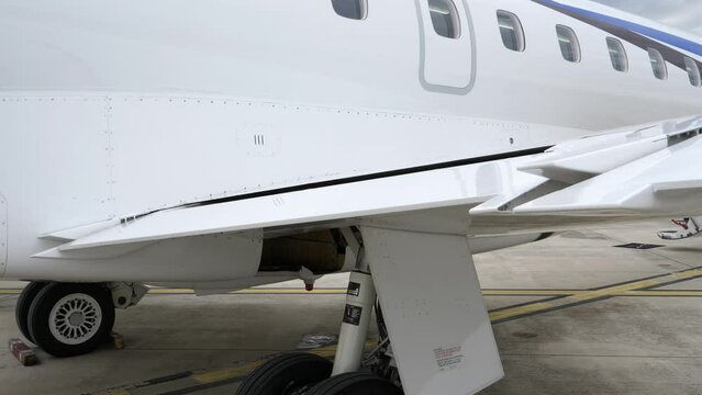 Lowering of Airplane Flaps at Trailing Edge of Wing, Exterior View.