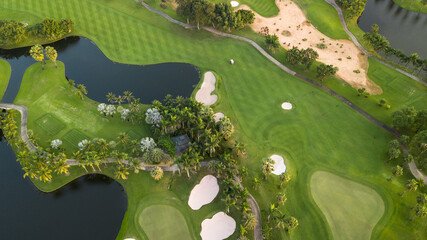 Aerial view of green golf course and putting green, Aerial view of green grass and coconut palm...