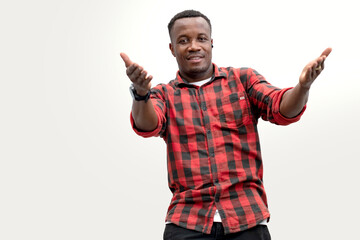 Fototapeta premium Happy African American man wearing Scottish shirt open arms on white background