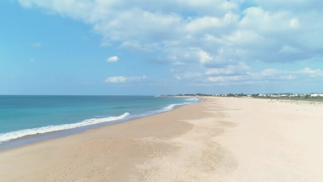 Aerial view flying over the iconic beach of Los Canos de Meca in Cadiz Spain