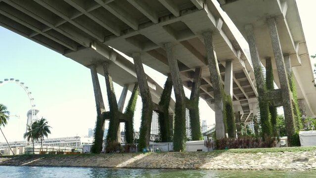 Amphibious bus passing by the bay at the Marina next to Singapore Flyer