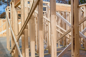 Wood framing beams of new house under construction in construction stage