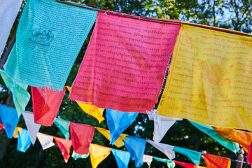 Rows of vibrant prayer flags for Tibetan Mongolian Buddhist shrine