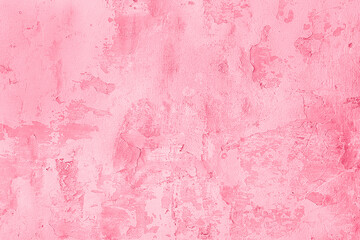 Trendy color of the year 2023. Surface of old shabby wall with falling off plaster, toned in viva magenta color as background or texture