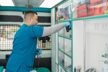 Medical personnel working inside an ambulance
