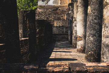 Fototapeta na wymiar Place of Worship, Historical sites ancient temple ruins Wat Si Chum and Wat Mahathat city of Sukhothai Historical Park, Sukhothai province, Thailand
