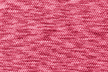 Trendy color of the year 2023. Texture patterned knit fabric toned in viva magenta color